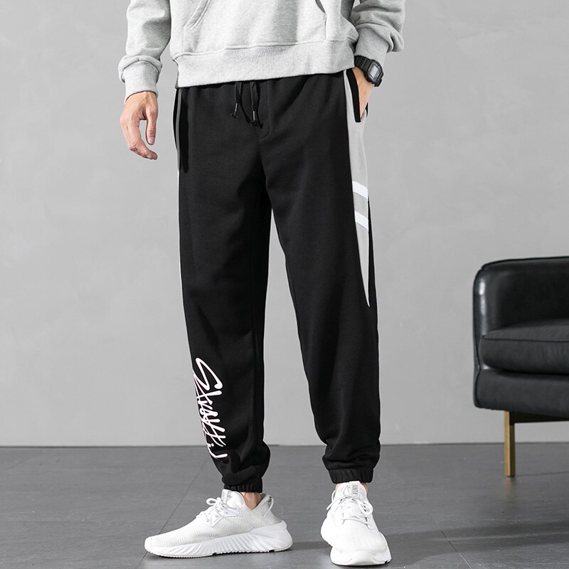 Streetwear løse mænd bukser udendørs sportsbukser ankel bundet mellem talje elastik mandlig hip-hop bogstav efterår lange bukser: L / Hh1728 sorte