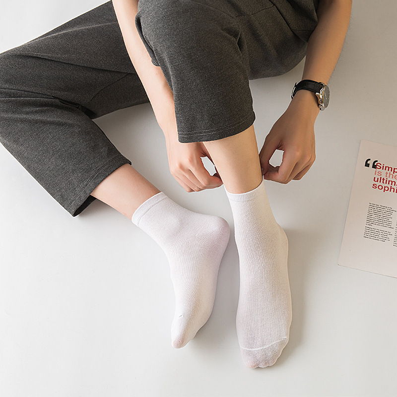 5 pares de calcetines de algodón de tubo medio de color sólido blanco y negro para mujer