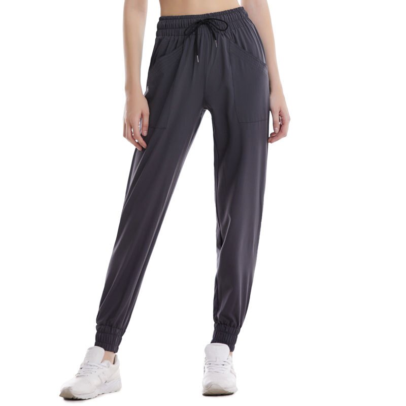 Pantalones informales de nueve puntos para mujer, ropa deportiva transpirable con puños abullonados, pantalón salvaje a la , para correr y entrenamiento