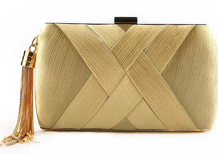 Hand holding dinner bag satin fringed dress bridal evening bag