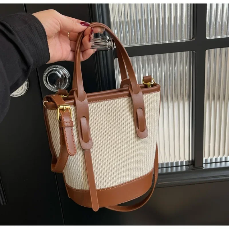 2025 polyvalent PU toile seau épaule et sacs à bandoulière Simple décontracté sens du luxe rétro sacs à main pour les femmes