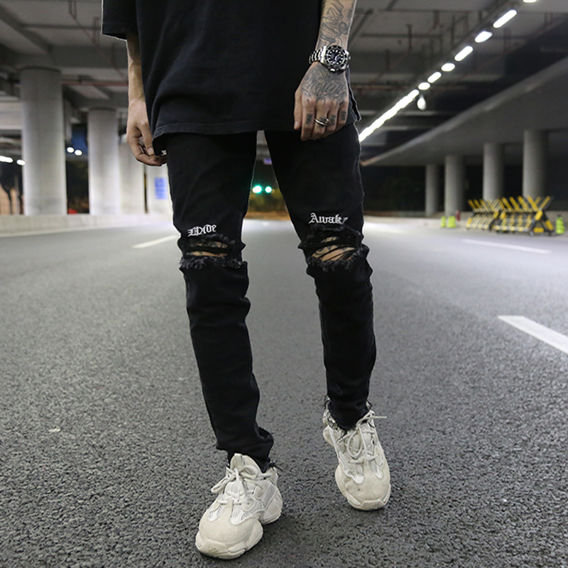 Pantalones vaqueros rasgados bordados hasta la rodilla para hombres Hip Hop skinny de motorista pantalones vaqueros rotos con cinta Slim Fit pantalones vaqueros negros Jogger