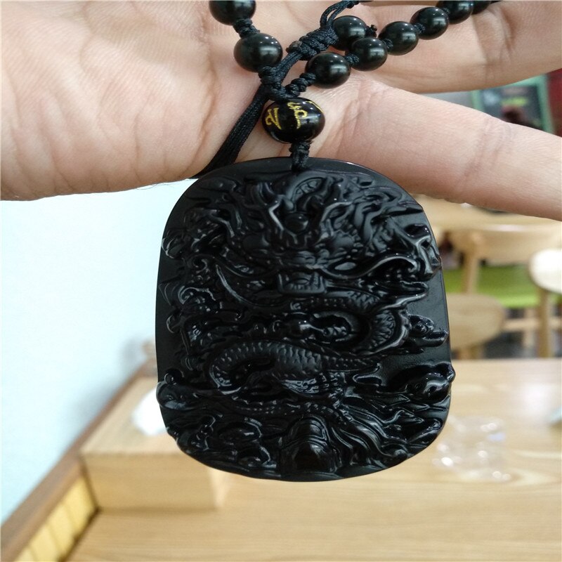 Energie van Chinese karakteristieke mascotte van natuurlijke obsidiaan draak