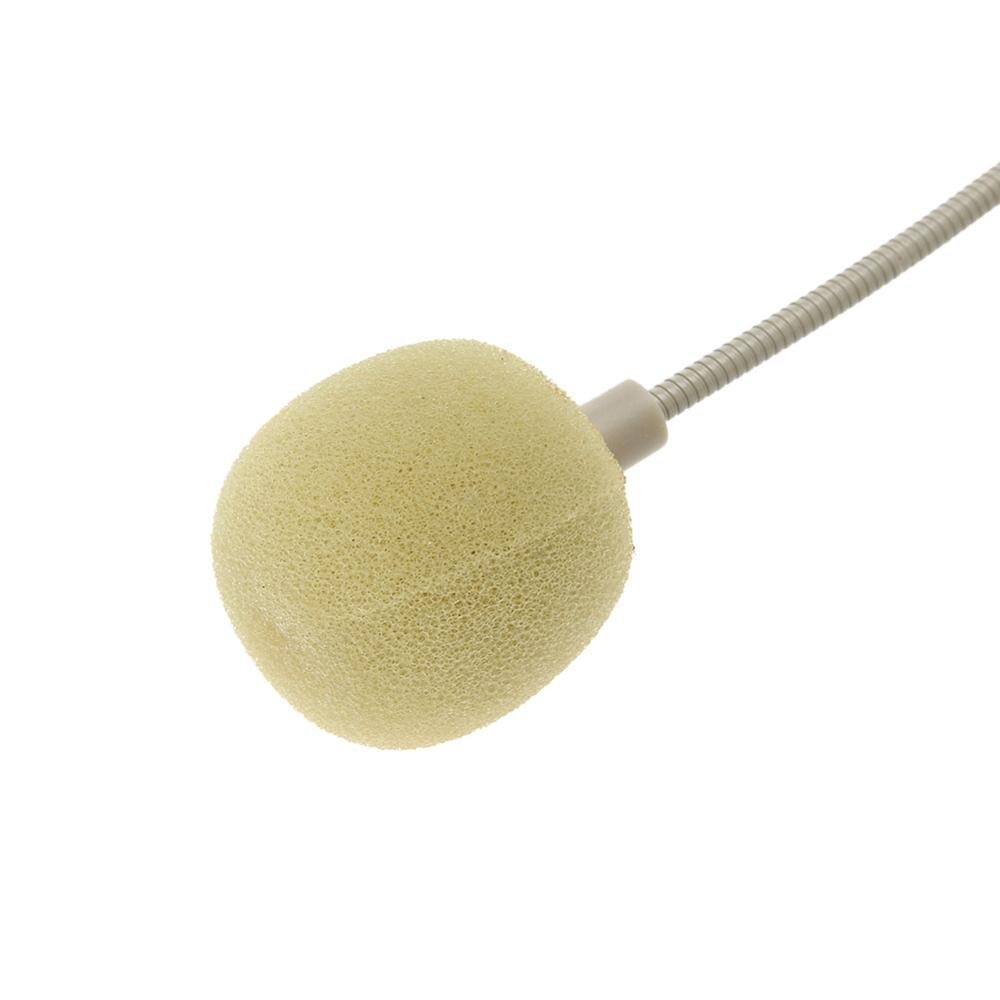 Hoofdtelefoon onzichtbare microfoon docent reisleider optreden hoofdmicrofoon voor op het podium luidsprekers stemversterker tv