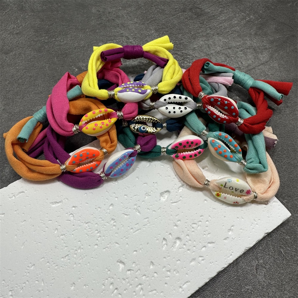 Bracciale con ciondoli a conchiglia a pois Linea di cotone colorata Braccialetti con corde intrecciate fatte a mano per gioielli da donna, uomo e bambino