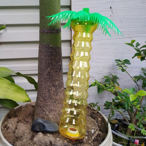 Sistema de riego por goteo automático de coco, dispositivo de riego automático con punta para plantas de jardín y flores de interior: larger yellow