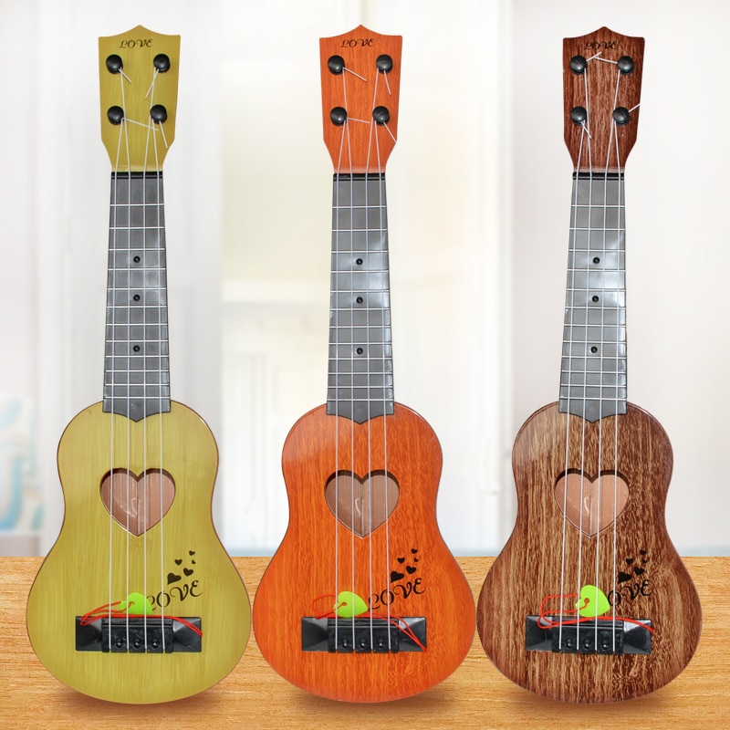 Mini ukelele instrumento Musical, guitarra infantil, juguetes creativos, juego escolar para niños, educación y aprendizaje, de Navidad