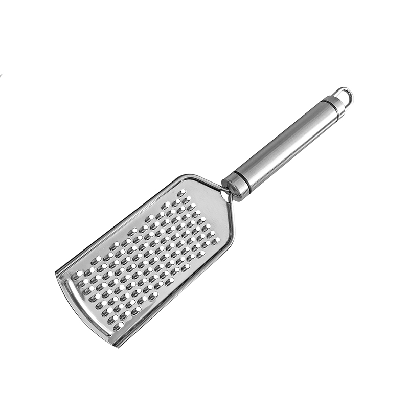 Skrobaczka robić skórki cytrynowej i tarka robić sera-parmezan, cytryna, imbir, czosnek, gałka muszkatołowa, czekolada, warzywa, owoce, narzędzia kuchenne: szary