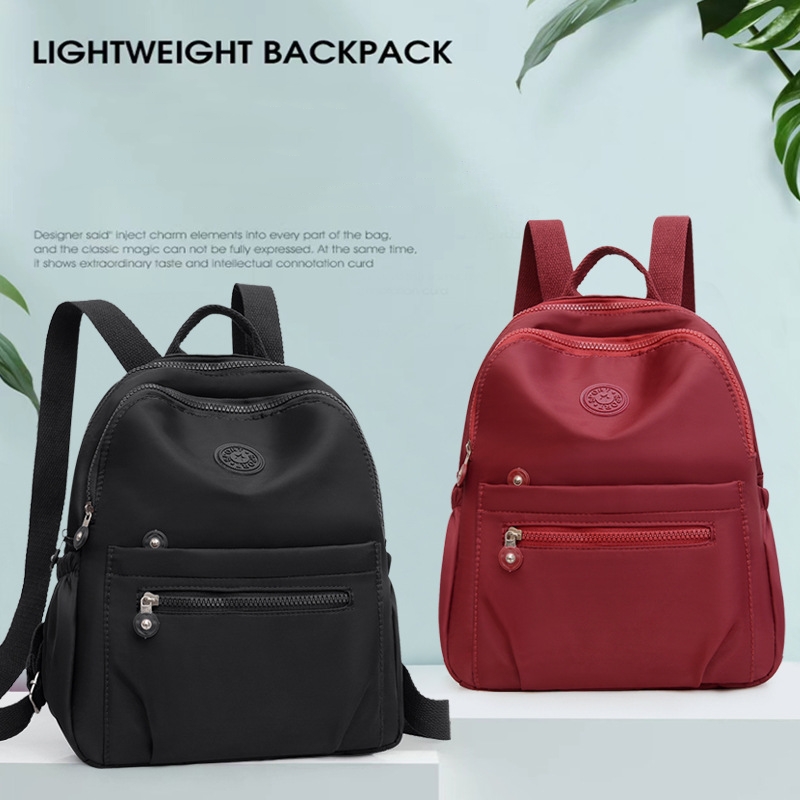 Mochila de nylon de cor sólida, bolsa escolar de viagem leve, mochila moderna para trabalho, bolsa de viagem pode ser pendurada em bagagem