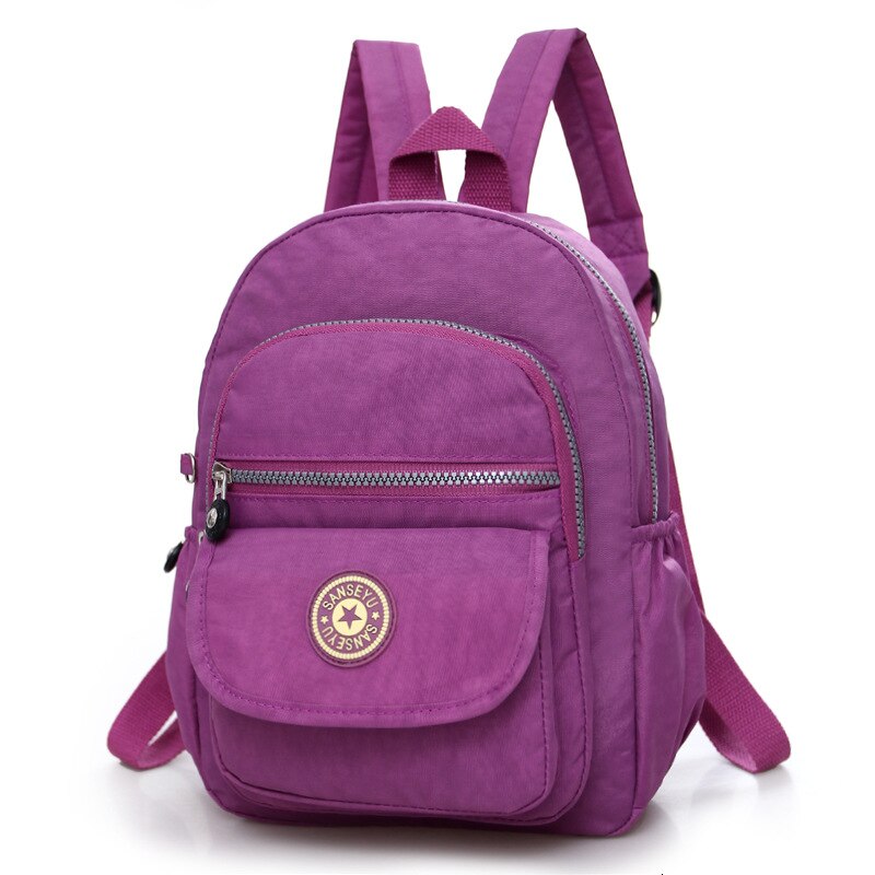 Kvinder nylon skole kvindelig rygsæk lille vandtæt rygsæk solid afslappet skuldertaske multifunktionelle skoletasker: Lys lilla