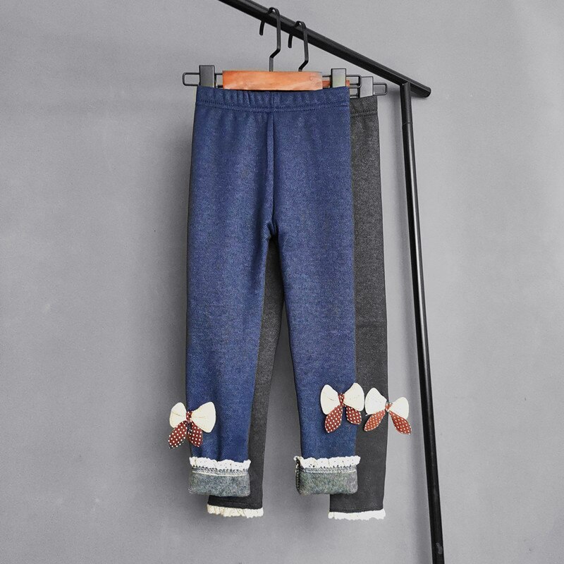 Pantalone in Denim imitazione bambina autunno inverno bambini Plus pantaloni lunghi in velluto neonate pantaloni caldi in pizzo con fiocco blu scuro nero