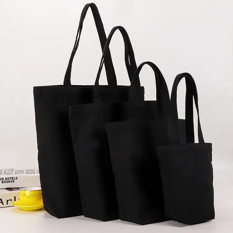 Bolso de mano de lona negra para estudiante, bolsa de algodón de un solo hombro, bolsa de compras grande, bolsillo de cinturón de lona, bolsa de cosméticos de