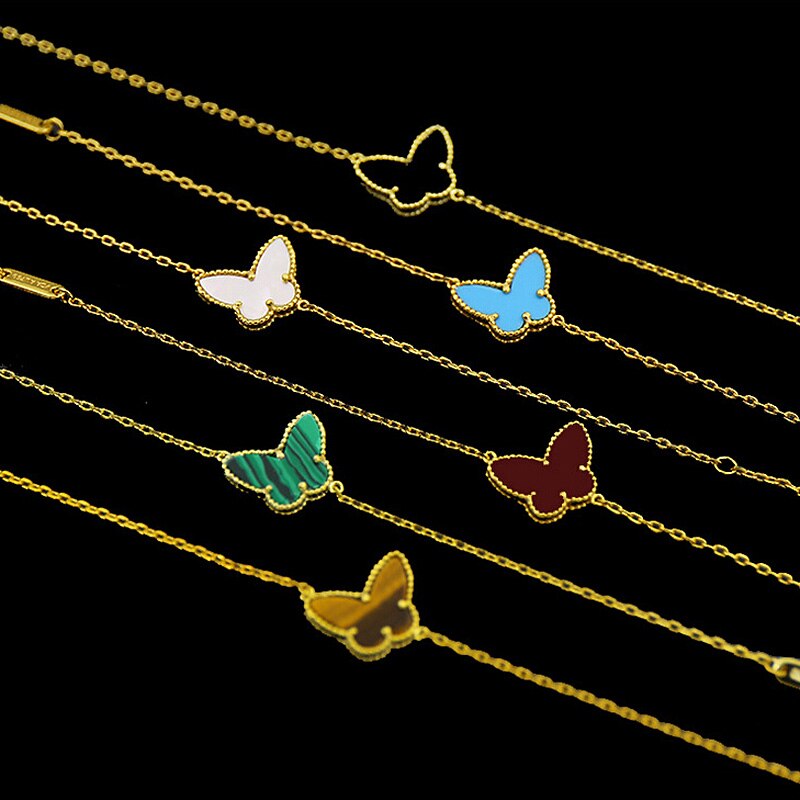 Guldfarvet sommerfuglearmbånd til kvinder