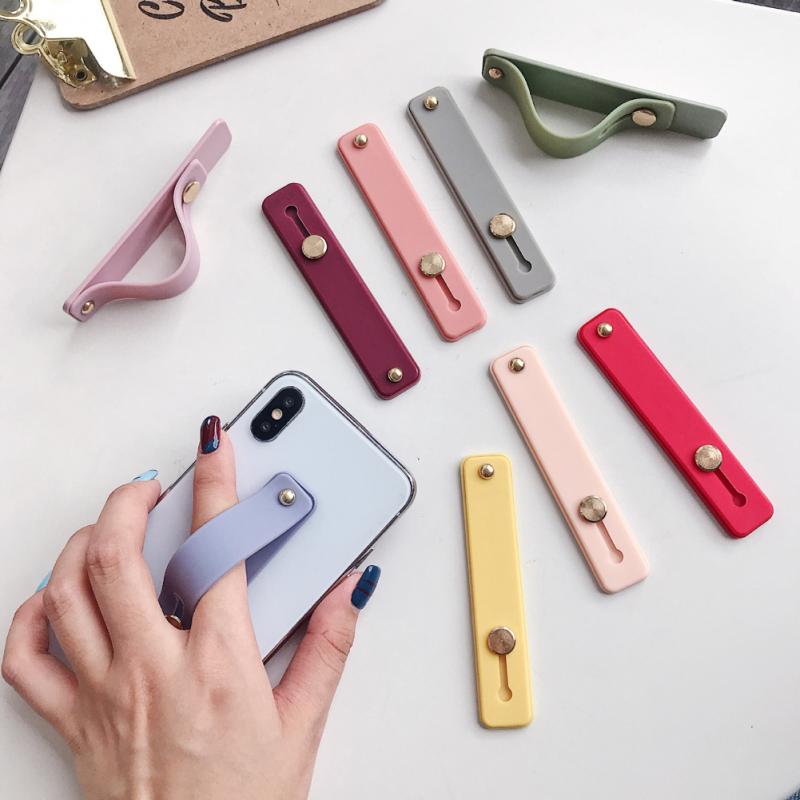 Muñequera de Color liso, banda de mano con agarre para el dedo, soporte para teléfono móvil, soporte de enchufe Universal para teléfono, anillo de agarre