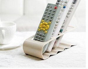Soporte de plástico para TV, DVD, práctico marco de cuatro mandos a distancia, soporte para teléfono móvil, estante de hasta 4 unidades