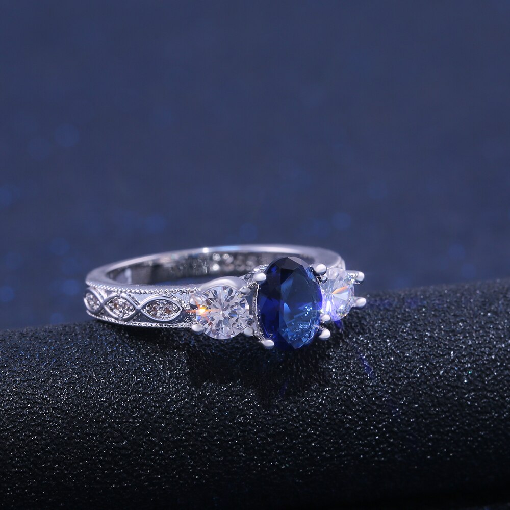 Huitan ovale bleu pierre bague de mariage de luxe Triple cristal pierre broche réglage avec motif de luxe bande femmes bijoux bague
