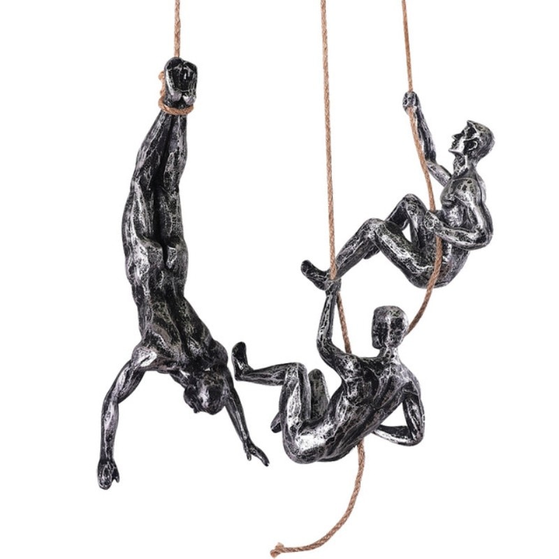 Man On Cliff Edge Holding A Hanging Woman Sculpture Wall Hanging