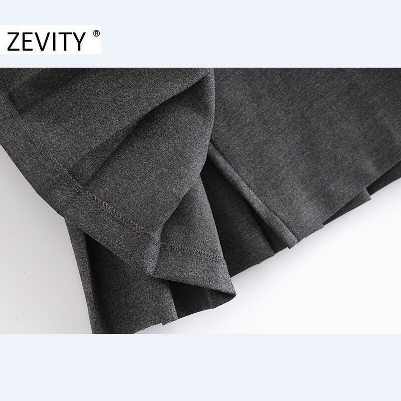 Zevity-Mini jupe plissée pour femme, décoration boucle douce, couleur unie, Style anglais, vêtement Slim et Chic, QUN703, décontracté