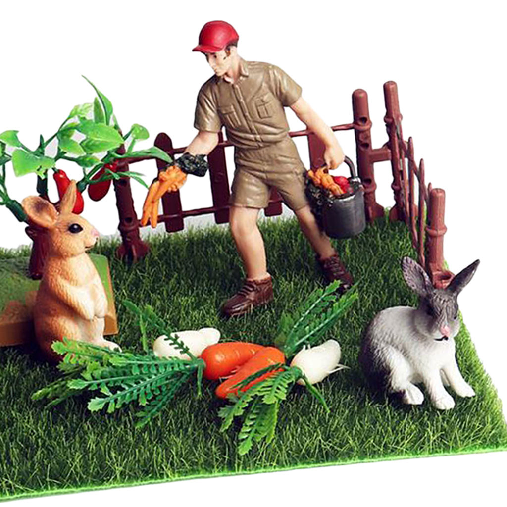 Miniatur-mikrolandschaftsdekoration mit kaninchen und karotten (nahaufnahme)