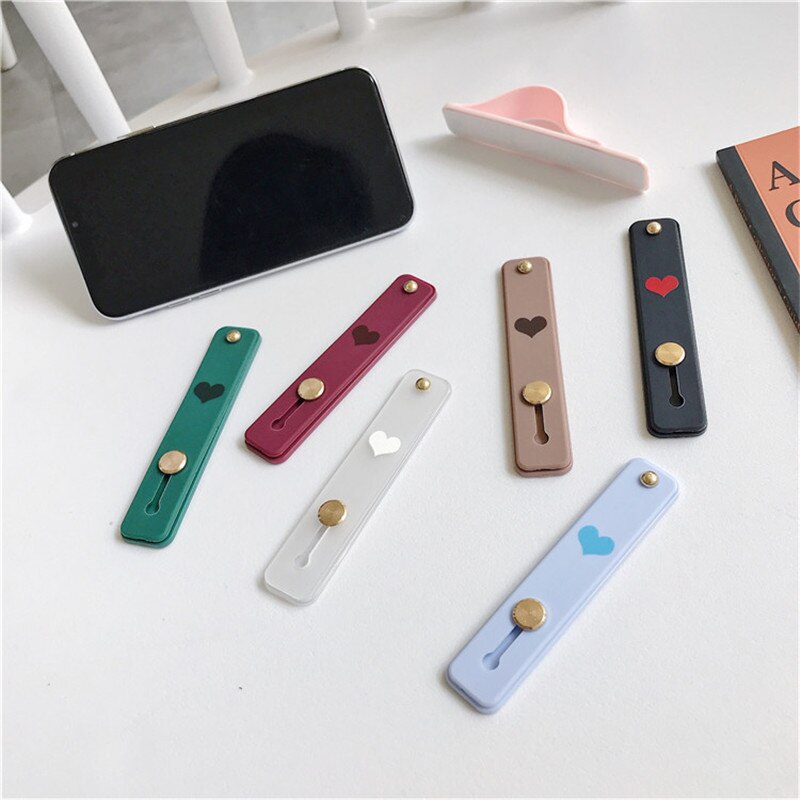 1 pz Candy color cuore custodia per cellulare staffa supporto per cinturino da polso push stretch cinturino da polso in silicone supporto per impugnatura per dito