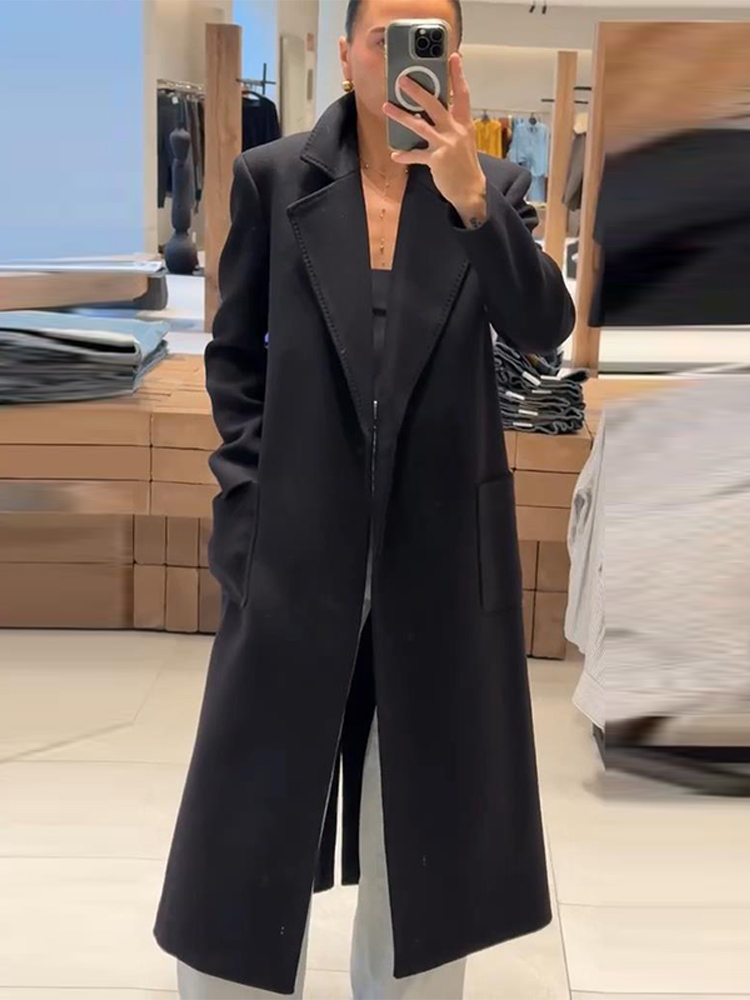 Elegante dames zwarte lange jas met riem Stijlvolle revers Veterschoenen Trenchcoat Herfst Winter Wolmix Bovenkleding Mode-outfit