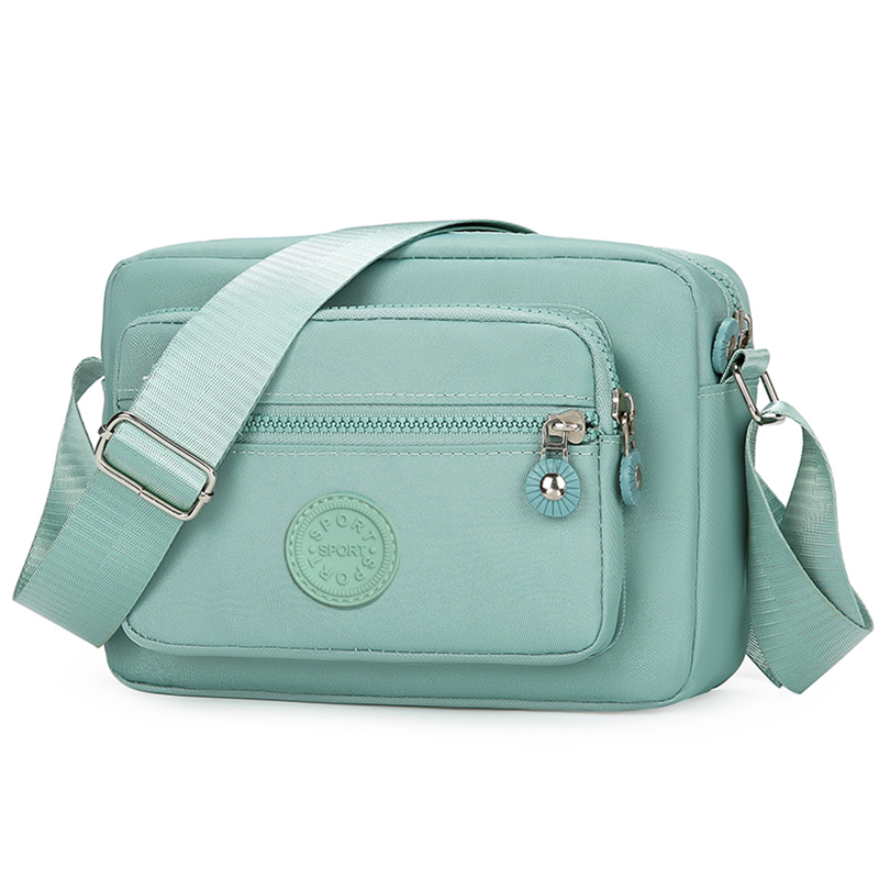 Bolso de mano de estilo neutro hecho de tela de nailon liviana y sencilla, bolso de mujer de un solo hombro. [La dirección de la cremallera está corrió: Verde