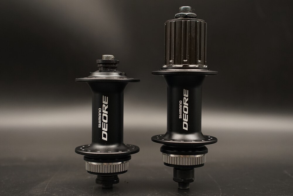 Shimano Deore HB - M615 centro delantero y trasero, cerradura central, Frente QR 9x100mm/trasero 10x135mm 1 par, negro