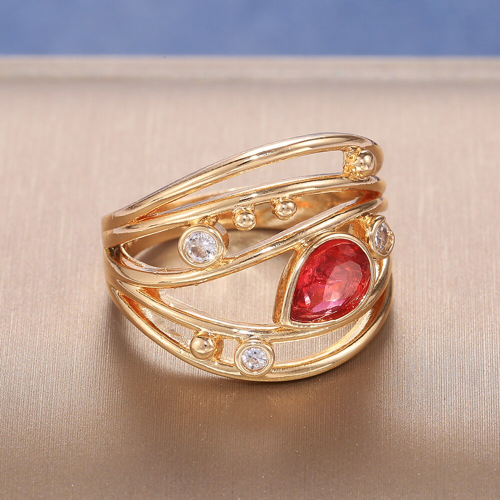Huitan kvinder vielsesringe smykker rød pære form zirkon luksus guld farve udhulet bånd engage fest ring