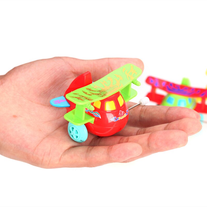 2022 New 1pcs Creative Children Clockwork Toy Novelty Cartoon Winding Winding Small Toy Winding Mini Gift: A small plane