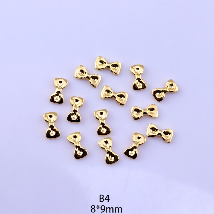 50 pezzi di ciondoli in lega d'oro e d'argento per unghie papillon farfalla 3D multi-forme accessori per unghie per ciondoli gioielli per chiodo arte giapponesi: Avorio