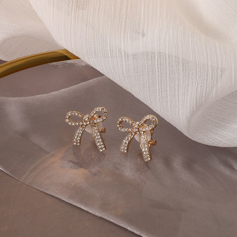 Pendientes de lazo anudado hueco a la coreana para mujer, aretes brillantes con diamantes de imitación, pajarita de cristal, aretes elegantes, de joyería