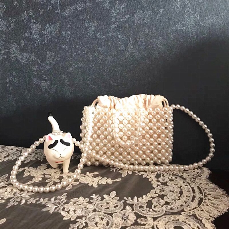 Za pearl armband väska bärbar halm vävd väska pärlstav axelväska crossbody väska