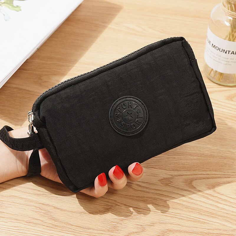 Nueva cartera de lona para mujer, bolso de teléfono móvil informal de Color sólido, bolsa de mano Horizontal con cremallera de tres capas, billeteras estándar para mujer