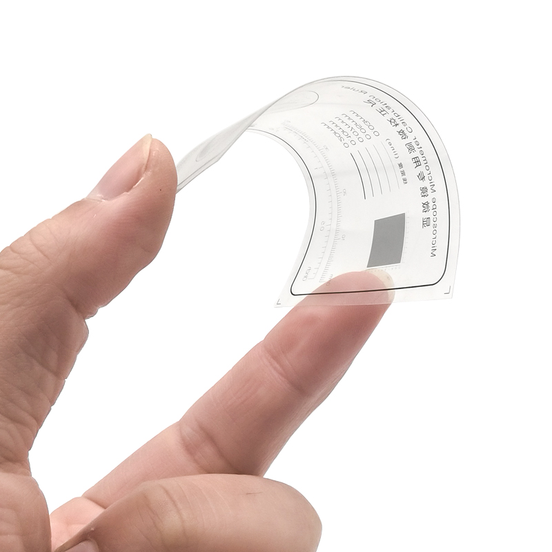 Kalibracja linijka folia przezroczysta mikrometr mikroskopu zwierzę domowe okrągły kształt średnica cząstek taśma pomiarowa linia współrzędnych