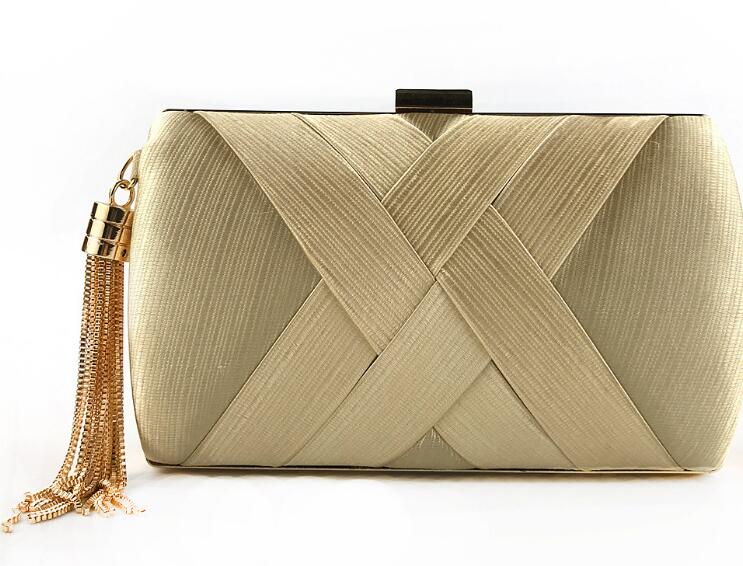 Hand holding dinner bag satin fringed dress bridal evening bag