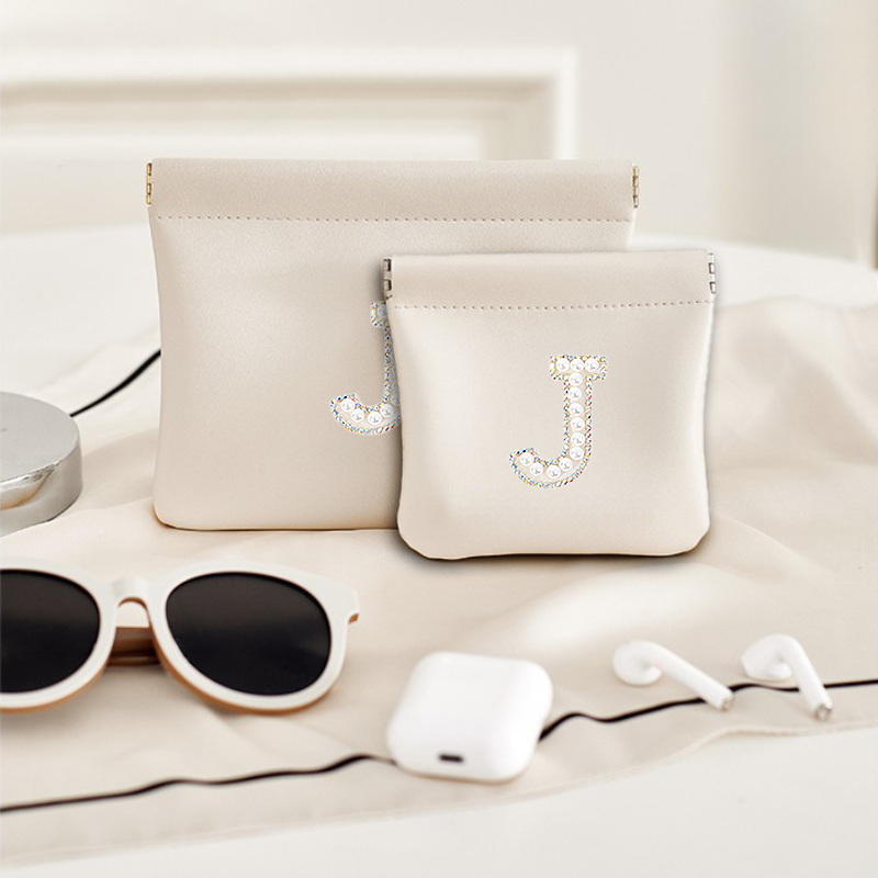 Pearl letter sticker PU bullet storage bag, earphone lipstick, change, makeup bag, fashionable and exquisite mini bag