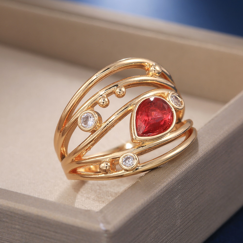 Huitan kvinder vielsesringe smykker rød pære form zirkon luksus guld farve udhulet bånd engage fest ring