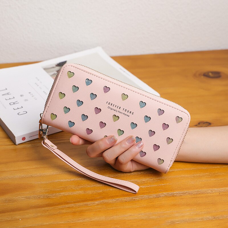 Kvinders tegnebog kvinder lang lynlås blød tegnebog udhulet hjerteform mobiltelefon taske kortholder møntpung: Lyserød