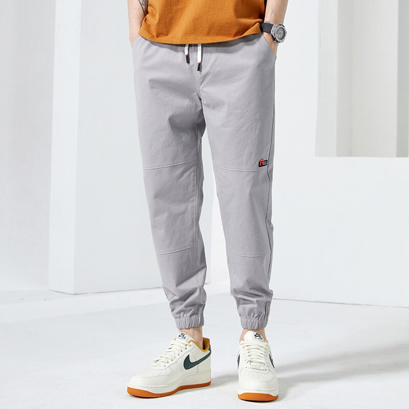 Moda Off White Casual Harem Pants męskie spodnie do biegania męskie Slim japońska moda uliczna kieszonkowe aplikacje Casual spodnie Harajuku: 4XL / Blue gray
