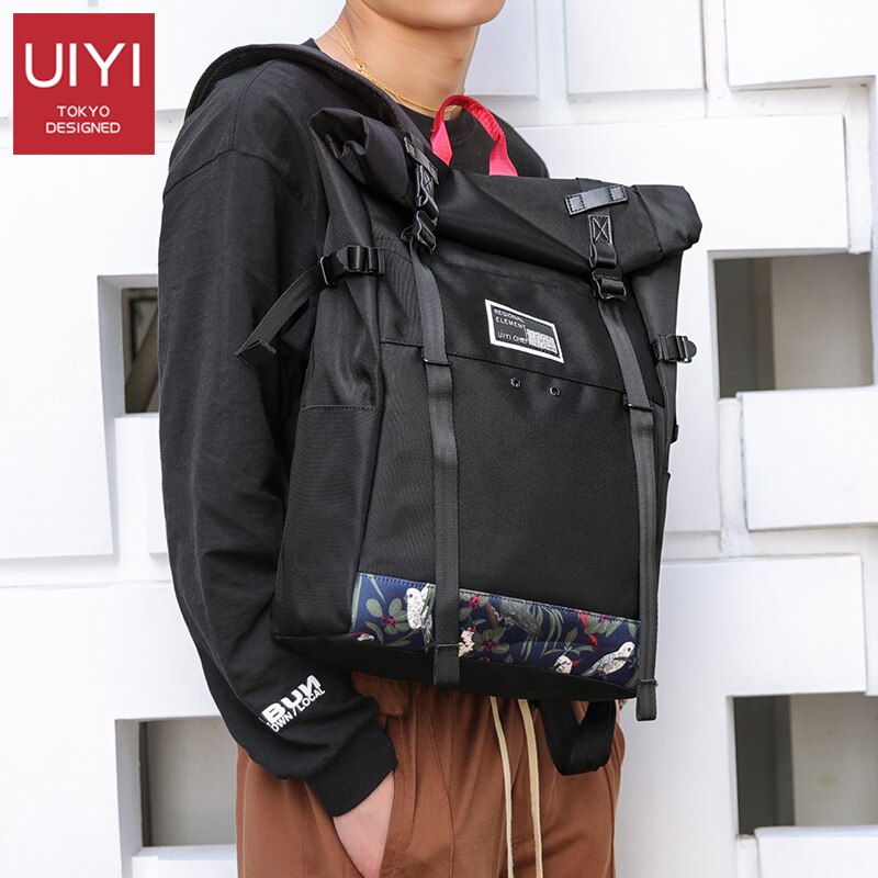 UIYI marca Coreana tampa do rolo de 15 polegada de viagem saco de escola mochila de esportes casuais saco dos homens laptop mochila mochilas à prova d' água