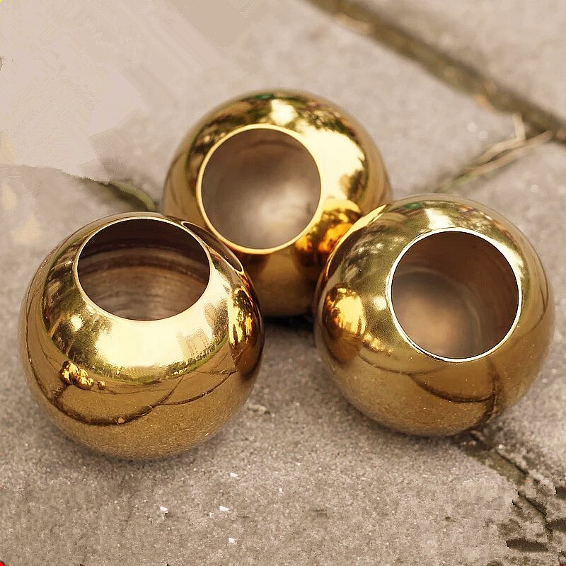 Förtjockad ihålig kula i rostfritt stål med ett hål, dekorerad med ihålig guldkula i metall, magisk kula för hemmet