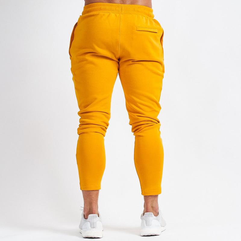 Sportbroek heren joggingbroeken joggingbroeken gele zomer effen broek zwarte joggingbroek fitness heren sportkleding broeken sport