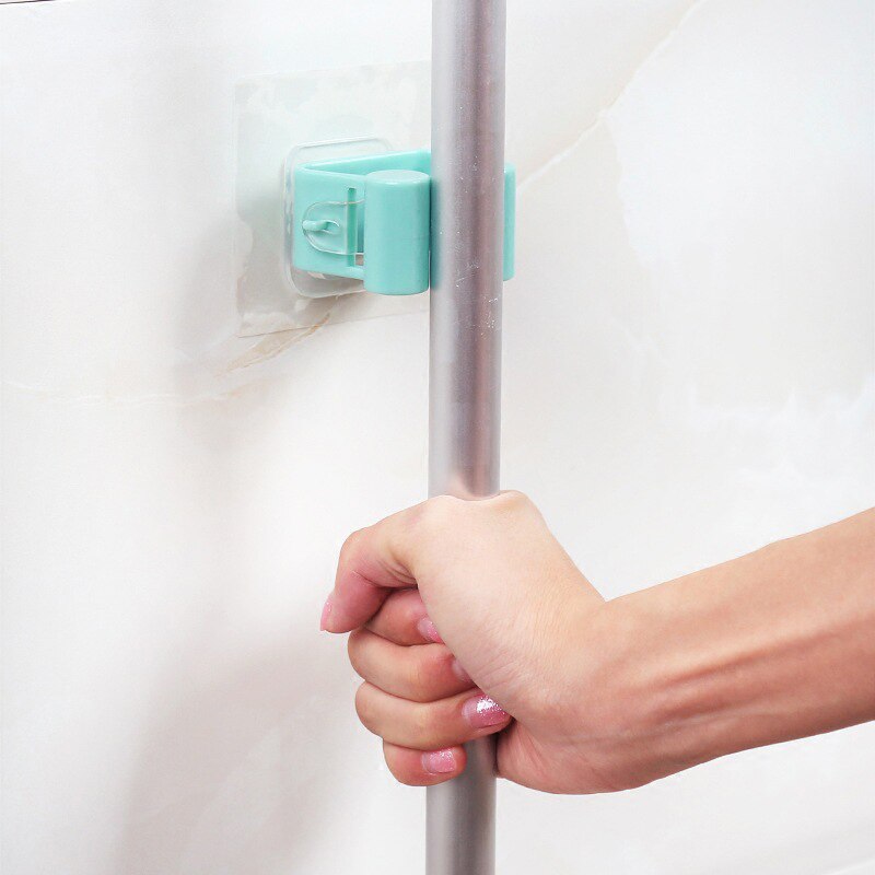 1 pz punzonatura gratuita Mocio gancio di alta qualità senza soluzione di continuità antiscivolo cremagliera di stoccaggio appeso a parete gancio di stoccaggio cremagliera porta scopa Mocio clip