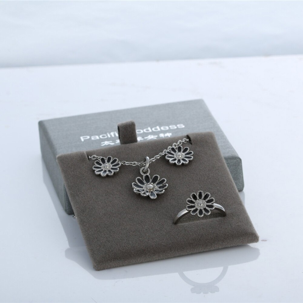 earrings necklace and rings set in stainless steel jewelry