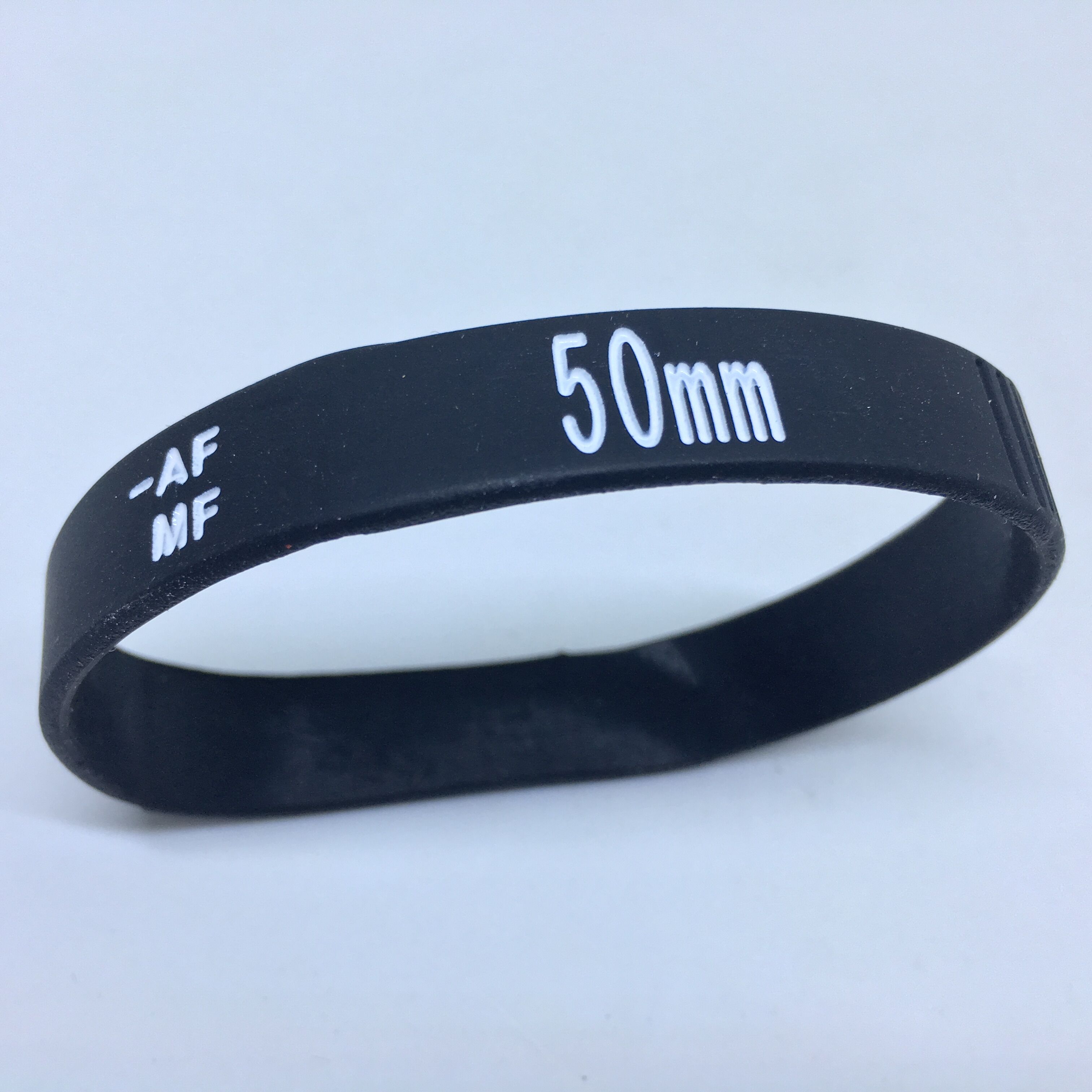 Nouveaux Bracelets d'objectif photographe silicone bracelet Bracelets objectif Zoom fluage pour canon nikon DSLR appareil photo: White 50MM