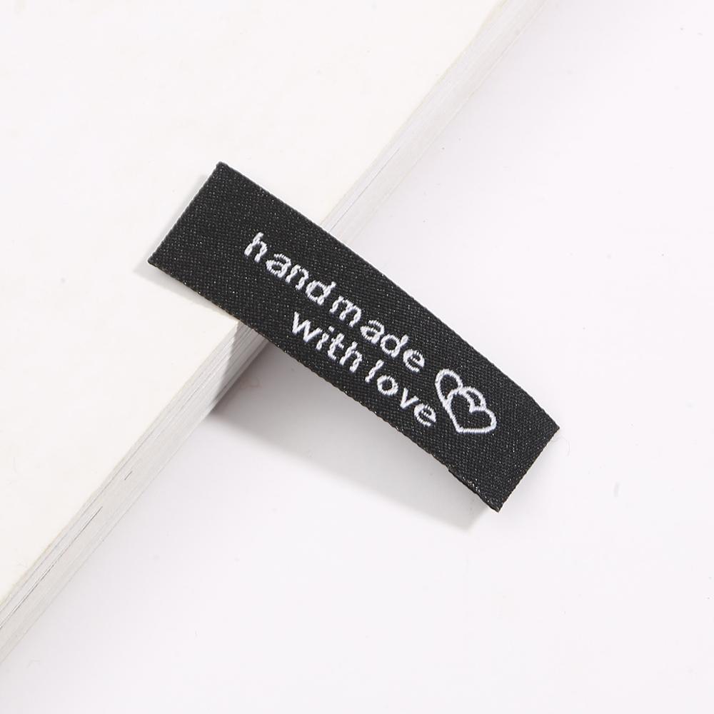 20 unids/lote 50x15x15mm hecho a mano etiqueta bordado impreso etiquetas ropa bandera etiqueta para prendas DIY Etiqueta de accesorios de costura: Black