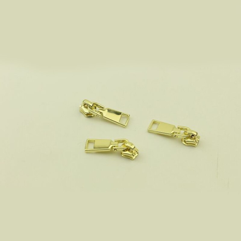 10 kpl jousilukkoa 3#  vetoketjun liukusäädintä metallisille vetoketjullisille takeille vaatteiden vetoketjun korjaussarja vetoketjun vetimet tee-se-itse-laukkujen ompelutarvikkeet: Vaaleankeltainen -no3