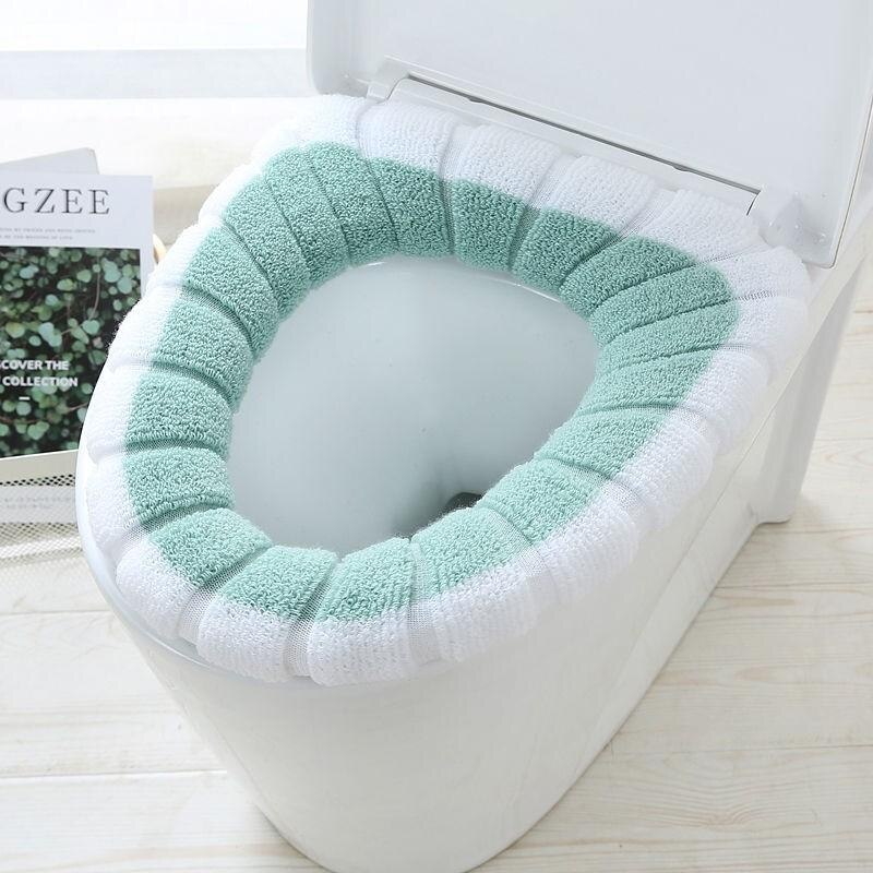 La couverture confortable de siège de toilette est des articles sanitaires chauds, doux et réutilisables de flanelle: Green and white