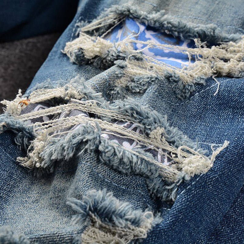 Jeans Patch da uomo con stampa Bandana Paisley fori Streetwear pantaloni strappati in Denim elasticizzato strappato pantaloni Slim affusolati