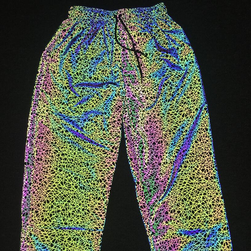 Pantalones Jogger informales luminosos coloridos de hip-hop para hombres europeos y americanos con patrón caótico reflectante